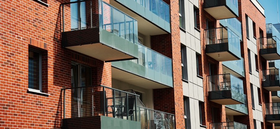 Outside of a building with balconies.