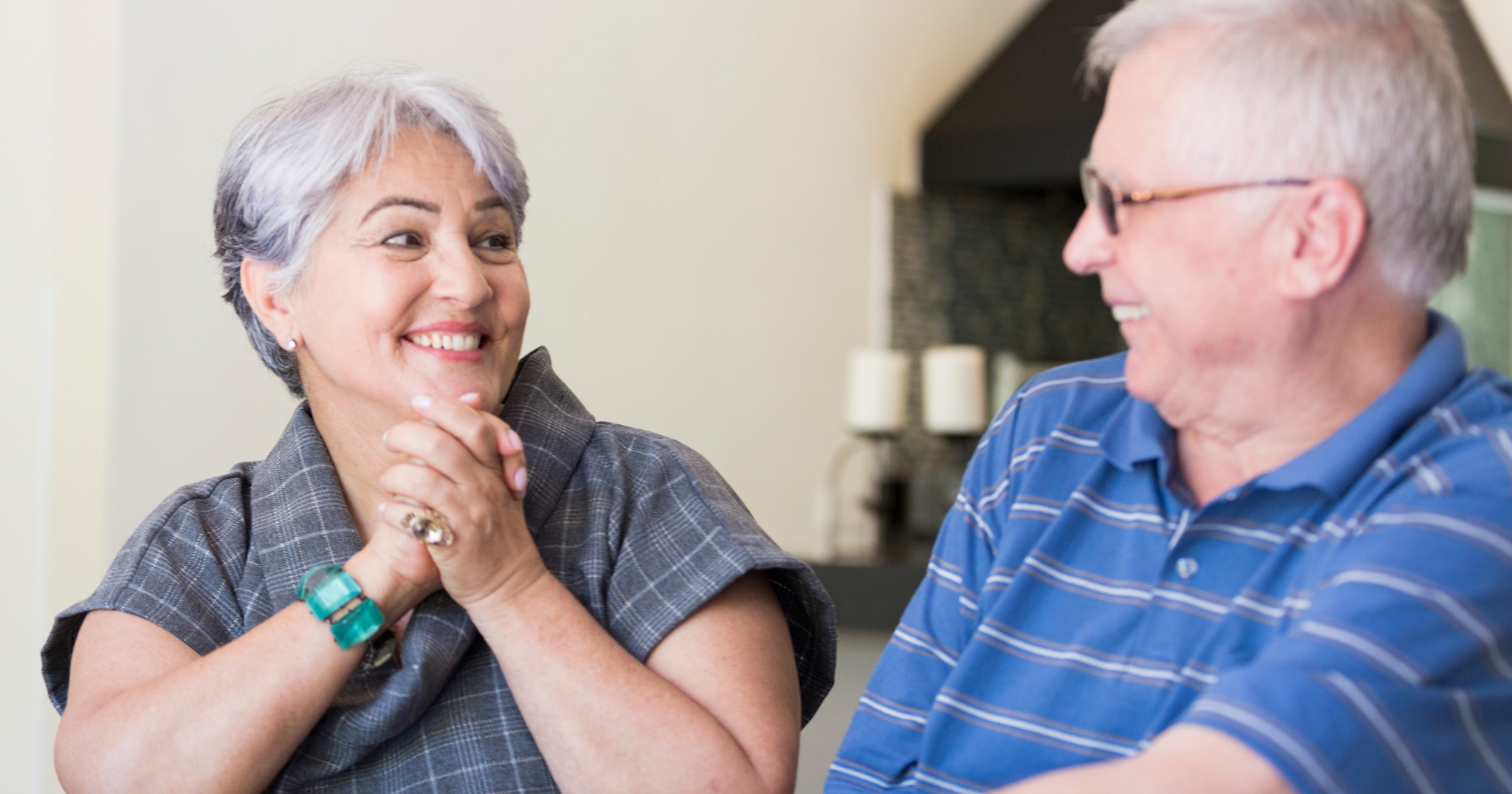 Two people smiling at eachother.