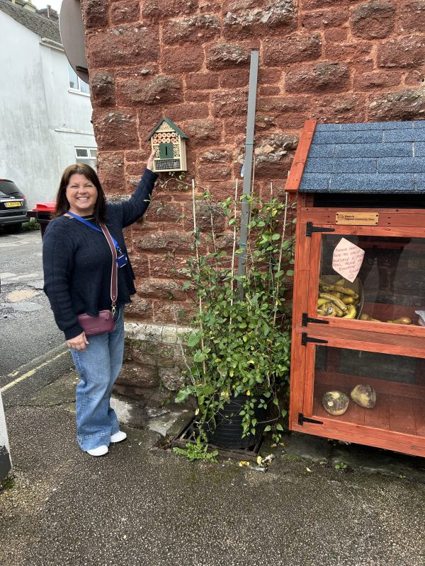 Woman with bug hotel.