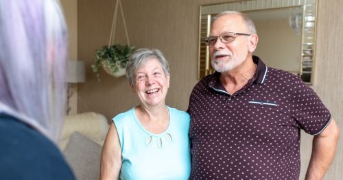 Two people smiling.